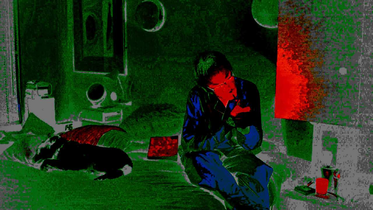 a person smoking on a bed next to a dog